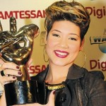 The Voice, Tessanne Chin, holds aloft the winner’s trophy during a press conference at the Norman Manley International Airport following her return home on Friday. Read more: http://www.jamaicaobserver.com/news/Tessanna-says-thanks_15679960#ixzz2oCZCjrX2