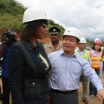 Chinese ambassador to Jamaica Dong Xiaojun shows Portia Simpson around the North/South Highway construction