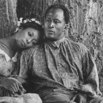 Madge Sinclair and actor John Amos in a film