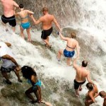 Tourists climbing Dunn's River Falls