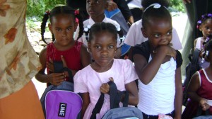 Kids displaying school bags provided by LIME