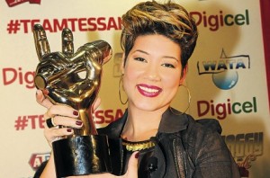 The Voice, Tessanne Chin, holds aloft the winner’s trophy during a press conference at the Norman Manley International Airport following her return home on Friday. Read more: http://www.jamaicaobserver.com/news/Tessanna-says-thanks_15679960#ixzz2oCZCjrX2