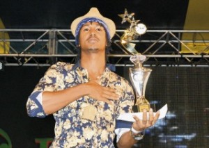 Deep Jahi holds up his trophy for winning with "I Love JA"