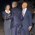 Prime Minister Portia Simpson greets President Obama, while Governor General looks on!